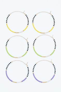 Our neon beaded hoop celebrates the fun, vibrant colors of the season. These pieces are perfect for a summer party or cook-out. They add a "pop" of color to any outfit! These lightweight, gold filled hoops are made with gold, white, black, and your choice of neon green, orange, yellow, purple, or pink beads. Gold Beaded Earrings For Summer, Multicolor Gold Beads Jewelry For Summer, Summer Party Hoop Jewelry, Trendy Gold Beaded Earrings For Summer, Gold Beaded Small Hoop Earrings For Summer, Gold Beaded Bracelets For Summer Parties, Multicolor Gold Beaded Jewelry For Summer, Fun Yellow Beaded Bracelets For Summer, Adjustable Beaded Circle Earrings For Summer