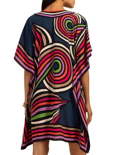 Lightweight and colorful, this floaty silk caftan is beautifully worn as a poolside swimsuit cover-up, or as a top for date night in the city; this wardrobe-essential is the piece you'll want in more than one color or pattern. Round, cutout neckline Relaxed, caftan fit Length: 36" Model is 5'10", wearing size XS/S FABRIC: Linear Fleur-de-Lis Silk Crepe de Chine 100% Silk Dry clean only Imported Vibrant Print V-neck Kaftan For Beachwear, Summer V-neck Tunic With Vibrant Print, V-neck Viscose Kaftan For The Beach, Chic Silk Kaftan For Beach Cover-up, Vacation Rayon Cover-up, Chic Beach Dress With Abstract Print, Beach Viscose Tunic, Spring Beach Tunic Made Of Viscose, Multicolor Tunic Style Beachwear Cover-up