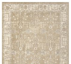 an area rug with beige and white colors