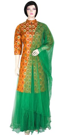 This extravagant long kurti & lehenga set consists of a banarasi 3/4 Sleeves kurti with multi color zari betel leaf motif embroidery & net skirt & dupatta. It's kurti is designed in jacket style with front open & a concealed zipper. This lightweight outfit comes with a comfortable elastic waist. Perfect for any occasion! Lining: Taffeta Stitching: Fully Stitched Care: Dry clean recommended Message: Please feel free to contact us to customize this outfit or add a matching stole/dupatta. Note: Product color may slightly differ from the image. Please note the we offer expediate shipping, that only speeds up the shipping time, our processing time will not be effected. Brocade Salwar Kameez With Zari Work For Wedding, Festive Banarasi Silk Palazzo Set With Resham Embroidery, Green Brocade Sharara With Zari Work, Designer Green Jamawar Anarkali Set, Festive Brocade Anarkali Set With Resham Embroidery, Chanderi Lehenga With Self Design, Bollywood Style Tissue Silk Anarkali Set With Pallu, Anarkali Style Green Jamawar Lehenga, Festive Resham Embroidered Long Lehenga