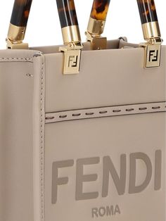 100% Calf Leather | Fendi Women's Sunshine Handbag in Dove Grey/Gold Soft | FW23/24 Sunshine Logo, Fendi Sunshine, Grey Handbag, Gray Handbags, Antique Brass Metal, Mini Tote Bag, Dove Grey, Mini Tote, Brass Metal