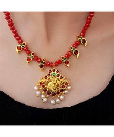 Product Description :  Handmade High quality Gold plated Maroon Kemp Annapakshi Pendant with Maroon Kemp Mango motif and Red Crystal beads Necklace Set with adjustable dori for perfect fitting. A perfect choice for your jewellery collection. Suitable for Wedding, ethnic wear, festive and party wear. A beautiful gift for your loved ones. This product is especially handmade for you after receiving the order and takes 4 to 5 man hours to complete, hence slight imperfections are expected which is not a defect.  Slight color variation of the product may occur due to photographic light effect. Necklace Weight : 40 gms Dimensions : Necklace Length (w/o dori) - 21 cm, Dori Length - 26 cm, Pendant Height - 5 cm , Pendant Width - 4 cm Earring Height - 1.5 cm, Earring Width - 0.7 cm Material : Alloy Red Temple Necklace With Latkans For Gifts, Festive Red Necklace With Latkans, Festive Red Necklaces With Latkans, Red Round Beads Kundan Necklace For Festivals, Red Kundan Necklace With Round Beads In Temple Style, Red Beaded Kundan Necklace In Temple Style, Red Kundan Necklace With Round Beads For Festivals, Red Kundan Necklace Gift For Navratri, Red Kundan Necklace With Round Beads For Celebration