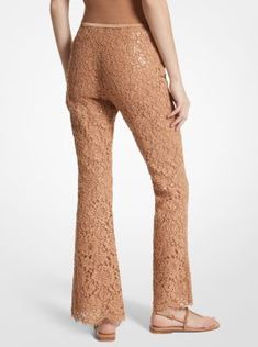 These lace bootleg pants glisten thanks to allover hand-embroidered sequins, which highlight the floral pattern. Cropped, scalloped hems allow for easy styling with heels and sandals alike. Made in Italy. Lace Flare Pants For Party, Lace Flare Bottoms For Party, Flare Lace Bottoms For Party, Fitted Embellished Pants For Fall, Spring Evening Lace Bottoms, Spring Lace Pants For Night Out, Lace Pants For Spring Night Out, Lace Pants For Night Out In Spring, Embellished Spring Bottoms