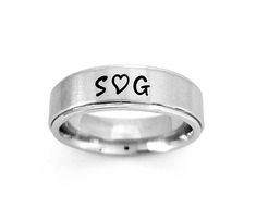 "AWESOME 6 mm Comfort Fit Band, goes on like silk and will be the most comfortable ring you'll ever wear. This is a stainless steel brushed finish on a flat surface with a shiny belveled rim. Add names, dates, quotes, coordinates, scripture or Roman Numerals. I hand stamp each letter then use the best quality black jewelry paint, clean and polish. If you want the ring with no paint in the stamping leave note. I ONLY stamp on the outside of the ring. To customize: at checkout in box \"note to Let Name Rings Silver, Dates Quotes, Expensive Wedding Rings, Stainless Steel Wedding Bands, Hand Stamped Ring, Wedding Band Engraving, Custom Wedding Band, Popular Rings, Name Ring