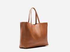 A highly functional hold all, this leather tote will carry all your essentials throughout the day. Boasting soft leather in a gorgeous deep color tone, complete with sturdy leather handles and an inner zip pocket for added security. Handmade in Italy, 100% from NATURAL genuine leather. The bag features a small inner pouch (zippered) and a natural leather lining with no fabric linings. Professional craftsmanship ensures excellent quality with a soft yet strong genuine leather touch! Dimensions: W Versatile Everyday Satchel With Smooth Grain, Smooth Grain Satchel Shoulder Bag For Shopping, Leather Bag With Top Carry Handle For Daily Use, Everyday Smooth Grain Satchel Shoulder Bag, Everyday Smooth Grain Satchel With Double Handle, Versatile Tote Satchel With Smooth Grain, Versatile Tote Shoulder Bag With Smooth Grain, Everyday Satchel With Smooth Grain And Double Handle, Versatile Leather Satchel For Everyday Use