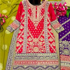 Heavy Embroidered Neon Pink Kurta Top. Dark Purple Embroidered Pants With Green Dupatta With Embroidered Purple Border And Motifs. New And Unworn Purple Floral Embroidered Sharara For Eid, Purple Floral Embroidery Sharara For Eid, Purple Embroidered Fabric For Eid, Embroidered Purple Sharara, Bollywood Style Purple Salwar Kameez With Floral Embroidery, Purple Long Sleeve Sharara With Intricate Embroidery, Festive Purple Embroidered Fabric With Dabka Work, Purple Border, Green Dupatta