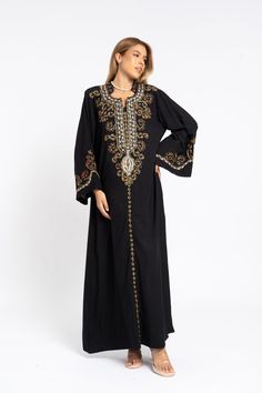 This stunning kaftan with its monotone embroidery will be your summer favorite. It is an extremely comfortable wear, light and soft and can be used on many occasions -  home gatherings, festival parties, summer occasions, dinners, or just in your home to feel comfortable.  Fabric : 70% Egyptian Cotton and 30% Polyester Sizes : The dress comes in two sizes. S/M/L which fits up to a size 14 US (Large) and one that fits up to a size 22 US (2XL). It comes with a cinch in the back to accentuate your beautiful body.   Kaftan measurements in inches : S/M/L Bust : 44-45 Hip : 50-51  X/2XL Bust : 49-50 Hip : 55-56 Length : 57 inches For reference, the model is 5'6" (170cm) and a size 6 US (small) and is wearing a large . The kaftan comes with a cinch in the back which is used to tighten across the Traditional Embellished Dress With Kimono Sleeves, Bohemian Black Abaya With Dabka Detailing, Embellished Kaftan With Kimono Sleeves For Eid, Eid Embellished Kaftan With Kimono Sleeves, Eid Embellished Maxi Embroidered Dress, Black Long Kaftan With Dabka Work, Floor-length Resham Embroidered Kaftan, Traditional Embellished Kaftan With Kimono Sleeves, Black Maxi Length Kaftan With Dabka