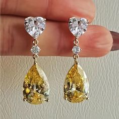 Beautiful Dangling Heart Shape Earrings, Elegant And Classy! Yellow Cubic Zirconia Party Earrings, Yellow Heart-shaped Earrings For Gift, Yellow Heart Earrings For Gift, Yellow Heart-shaped Jewelry, Heart-shaped Yellow Jewelry For Weddings, Heart Shaped Yellow Jewelry For Wedding, Elegant Yellow Teardrop Dangle Earrings, Heart Cut Yellow Jewelry For Anniversary, Yellow Heart Cut Jewelry For Anniversary