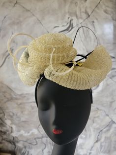 A cream and gold crinoline fascinator with biot feathers on an Alice band. Luxury Gold Fascinator With Structured Crown, Elegant Feathered Fascinator For Party, Elegant Feather Fascinator For Party, Elegant Feathered Headpiece For Vintage Events, Elegant Party Fascinator With Feather Trim, Gold Evening Hat For Spring, Gold Mini Hat For Spring Evening, Gold Mini Hat For Evening In Spring, Gold Mini Hat For Spring Evenings