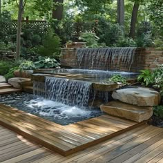 a small waterfall in the middle of a wooden deck