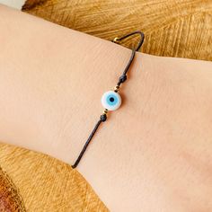 Evil Eye adjustable Bracelet it is made with quality Jewerly materials and it fits very comfortably Trendy Adjustable Evil Eye Friendship Bracelets, Handmade Adjustable Evil Eye Bracelet For Friendship, Adjustable Evil Eye Friendship Bracelet, Adjustable Evil Eye Bracelet For Friendship, Adjustable Cord Beaded Bracelets As Gift, Adjustable Bracelets With Nylon Cord, Casual Bracelets With Sliding Knot For Gift, Resizable Beaded Bracelets As Gift, Adjustable Spiritual Wristband For Everyday