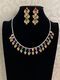 Multi color ahamedabadi kundan necklace with earrings White Necklace With Latkans For Party, White Necklaces With Latkans For Parties, Party White Necklace With Latkans, Party White Tassel Necklaces, Festive Multicolor Jewelry Sets With Latkans, Multicolor Chandbali Kundan Necklace In Temple Jewelry Style, Multicolor Latkans Jewelry Sets For Diwali, Multicolor Kundan Necklace For Diwali Party, Festive Multicolor Kundan Necklace With Latkans