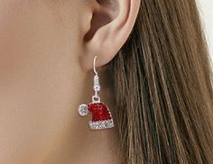 These Christmas-inspired Santa Hat earrings feature a 1/2" x 1/2" size, red and clear cz's and a classic fishhook style. Stylish and charming, these earrings are sure to be a holiday hit. Beachy Anklets, Celebrity Style Jewelry, Funny Sweater, Christmas Santa Hat, Flamingo Earrings, Cartilage Jewelry, Piercing Aftercare, Angel Earrings, Christmas Bracelet