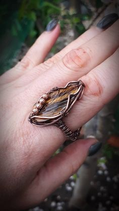 Tiger eye leaf ring, Wire wrapped copper ring, Adjustable ring for woman https://etsy.me/2vOIx43 #jewelry #ring #black #oval #yellow #copper #women #stone #bohohippie Tree Of Life Ring, Wrapped Rings, Ring Wire, Wire Wrapped Ring, Emotional Body, Copper Ring, Snake Ring, Diy Rings, Leaf Ring