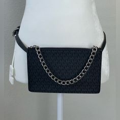 Black Synthetic Material With Mk Logo All Over In A Dark Gray Color. Silver Metal Chain At Zipper. Belt Is Size Small. Bag Is 8 X 5 And Almost An Inch In Width. Black Shoulder Bag With Belt Loops, Trendy Michael Kors Black Bag, Casual Black Michael Kors Bag, Michael Kors Trendy Black Shoulder Bag, Trendy Michael Kors Black Shoulder Bag, Trendy Black Michael Kors Shoulder Bag, Michael Kors Black Bag With Chain Strap, Michael Kors Belt, Zipper Belt