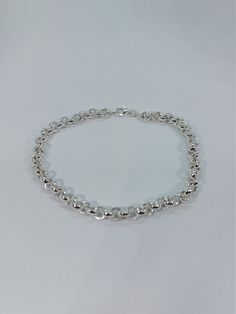 This beautiful delicate bracelet has been carefully crafted in solid 925 sterling silver. Great for any occasion! Buy it for your-self or for someone you love. Bracelet can also be resized at no extra cost and it will be shipped to you in an elegant gift box. A tracking shipping number will be provided to you once the bracelet has been mailed. Bracelet length: 8 inches Bracelet width: 8 millimeters or 0.31 inches  Weight: 17.1 grams Materials: 925 Solid Sterling Silver, also available in 10k Yel Elegant Sterling Silver Bracelet With Rolo Chain, Classic Silver Chain Charm Bracelet As Gift, Sterling Silver Charm Bracelet With Rolo Chain, Silver Charm Bracelet With Rolo Chain For Gift, Sterling Silver Rolo Chain Charm Bracelet Gift, Sterling Silver Charm Bracelet With Rolo Chain For Gift, Silver Chain Bracelets As Gift, Round Silver Chain Bracelets As Gifts, Minimalist Sterling Silver Hallmarked Bracelet As Gift