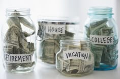 glass jars filled with money labeled retirement