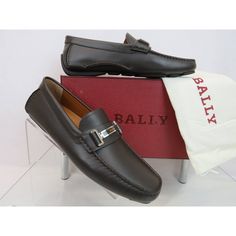 Drulio Brown Smooth Leather Metal Logo Driving Loafers By Bally Made In Italy 100% Authentic,Guaranteed Color: Chocolate (Print On The Box) Calf Soft Leather Upper Stitched Detailed Slip-On Silhouette Squared Moc Toe Metal Lettering Logo Silver Plate Across Vamp Removable "Bally" Stamped Logo Leather Insole Leather Lining Rubber Driver Sole "Bally" Logo At The Back Heel Size Eu 10.5 / Us 11.5 D / Fr 44.5 - Print On The Box Original Price $600 Note!!! These Shoes Came From Bally Store In Its Orig Designer Brown Loafers With Leather Footbed, Designer Brown Moccasins With Rubber Sole, Formal Brown Moccasins With Branded Insole, Classic Brown Flat Moccasins, Designer Brown Leather Shoes For Work, Brown Flat Dress Shoes For Formal Occasions, Designer Brown Moccasins With Leather Sole, Designer Brown Slip-on Loafers, Designer Brown Plain Toe Loafers