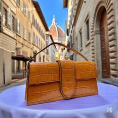 This bag has been made of the best genuine leather by local master crafters of Florence in Italy, designed for women who only accept premium Italian quality and luxury leather bags and modern Italian fashion. . Size: Width:   27 cm/10.75 inch Height:  14 cm/5.50 inch Depth:    6 cm/2.25 inch . The story of this bag: Once upon a time, in the heart of Florence, there was a small leather workshop run by a group of skilled artisans. The workshop had been passed down from generation to generation, and each artisan had inherited a passion for creating beautiful leather goods that reflected the unique beauty and history of Florence. One of the artisans was a woman named Elena, who had been crafting leather bags for over 20 years. Elena had a keen eye for design and a dedication to her craft that High-end Baguette Bag With Detachable Handle For Daily Use, Luxury Satchel Baguette Bag For Daily Use, High-end Satchel Baguette Bag For Daily Use, High-end Brown Handheld Box Bag, High-end Handheld Brown Box Bag, High-end Leather Baguette Bag For Daily Use, High-end Brown Satchel Flap Bag, Luxury Handheld Baguette Bag For Office, High-end Brown Rectangular Satchel