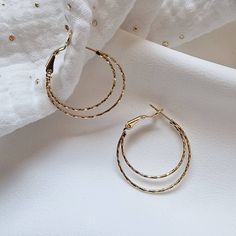 Gold plated double hoop earrings.  Catch the light thanks to the stripes textures. Elegant and light weight hoop earrings Elegant, perfect for all kind of events. Casual or fancy. > Material: Brass with 14 carats gold plating 3 microns >Size: 2,9 cm and inner hoop is 1,5 cm diameter >All jewelry will arrive gift ready in a box. Thanks and have a good shopping! Textured Metal Hoop Earrings For Gift, Minimalist Metal Hoop Wrap Earrings, Textured Gold-plated Hoop Earrings, Textured Gold Plated Hoop Earrings, Textured Small Hoop Earrings For Gift, Textured Small Hoop Earrings Gift, Everyday Small Hoop Textured Earrings, Creole Earrings, Double Hoop Earrings