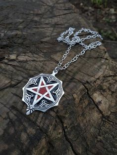 This is a very intricate and beautiful pentagram necklace, made for an equally interesting and beautiful lady from HELL, so surprise your oh so special demonic princess with this unique gift, and watch her bear her fangs in a grotesque smile that just warms the heart. It is a stunning yet simple piece of witchcraft and black magic art, all handmade for the dark witches of the world and beyond. There are 3 types of materials available, aluminium, bronze(golden color) and sterling silver. Sizes of Gothic Pendant Necklace As Gift, Gothic Pendant Necklace Gift, Gothic Pendant Necklace For Gift, Mystical Star-shaped Jewelry Gift, Red Star-shaped Sterling Silver Jewelry, Spiritual Halloween Festival Necklaces, Red Star Shaped Sterling Silver Jewelry, Red Sterling Silver Star-shaped Jewelry, Spiritual Necklaces For Halloween Festival