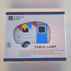 a box with a small blue and white camper on it