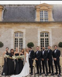 a group of people standing in front of a building