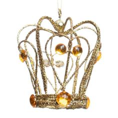 a gold crown ornament hanging from a chain