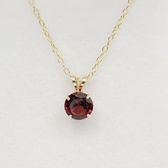 "10K Yellow Gold Genuine Garnet: 1.15ct Size of stone 6×6mm Pendant height: 0.40\" Pendant width: 0.25\" Made in Canada Chain Options: - Gold plated sterling silver chain 16\", 18\" - 10KT Yellow Gold 16\",18\", 20\" - 14KT Yellow Gold 16\",18\", 20\" - Thickness is 1-1.2 mm - Weight is 1-2.5 grams * Garnet is the birthstone for January and known as the stone of regeneration and passion * Comes in a Beautiful Gift Box | Perfect for Gifting ------------------------------------------------ * Please click here to visit my shop: https://www.etsy.com/shop/bestjewelryset * To see more pendants and necklaces please check out the link below:  https://www.etsy.com/shop/BestJewelrySet?section_id=35643902" Classic Round Cut Birthstone Gemstones, Classic Garnet Round Stone Jewelry, Classic Gemstones With Prong Setting For Gift, Classic 14k Gold Birthstone Necklace, Classic Birthstone Necklace, Classic Round Cut Birthstone Necklace, Classic Garnet Necklace For Anniversary, Classic Birthstone Gemstones, Classic Birthstone Necklace For Formal Occasions