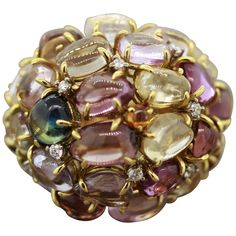 Luxury Cabochon Diamond Ring For Anniversary, Luxury Gold Round Cabochons, Luxury Cabochon Round Cut Rings, Luxury Multicolor Round Gemstones, Luxury Round Multi-stone Jewelry, Luxury Gold Formal Cabochons, Luxury Multicolor Cabochon Jewelry, Demantoid Garnet, Tanzanite Diamond Ring