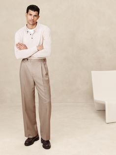 This relaxed pant is expertly cut with a wide leg and puddle hem from an Italian wool fabric we love for its subtle twill texture.  Designed to carry you through all seasons, this beautiful fabric is woven in a Super 120's weight--the perfect balance of fine handfeel, beautiful drape, and everyday durability.  Wrinkle-Resistant, Breathable, Stretch Mid rise.  Wide leg with extra length for a break at the hem Fabric from Italy's Lanificio Guabello.  Zip-fly with button closure.  Belt loops.  Four-pocket styling.  Wide-leg fit: High rise.  Tailored for the at-ease fit of traditional trousers, but with the extra wide-leg and full length of puddle-hem pants.  Wide leg opening measures 10" flat.  Inseams: Short 28. 5", Regular 30. 5", Tall 33. 5" Model: Size 32 Regular, 6'2" (188cm). Mens Trousers Fashion, Italian Pants, Old Money Outfits, Suit Pant, How To Hem Pants, High Rise Pants, Wool Pants, Khaki Color, Pants Wide Leg