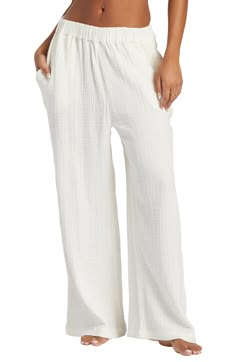 Perfect for casual days spent strolling the boardwalk, this pair of wide-leg pants is made from airy, gauzy cotton for a flowy fit. 27" inseam; 28" leg opening; 12" front rise; 14" back rise (size medium) Elastic waist Side-seam pockets 100% cotton Machine wash, tumble dry Imported Wide Leg Comfy Pants, Cute Flowy Pants, White Cotton Beach Pants, Beach Wishlist, Obx Wardrobe, Billabong Outfits, Social Outfits, Flowy Beach Pants, White Lounge Pants