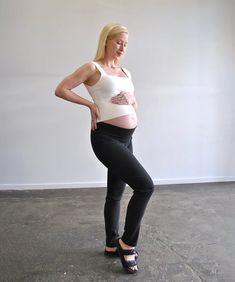 Discover the epitome of versatility and comfort with Around April's Work Straight-Leg Maternity Pants. Crafted from a premium blend of viscose, nylon, and Lycra, these pants are designed to move with you—offering the perfect fit at every stage of your pregnancy. Featuring a full length straight cut leg that looks great in heels or joggers. The unique high-back and low-front cut ensures the waistband stays in place whether you choose to fold it down or up for added support (pictured worn both way Versatile Fitted Pants For Pilates, Black Fitted Maternity Bottoms, Stretch Straight Leg Pants For Pilates, Versatile Bottoms For Pilates, Stretch Tapered Leg Bottoms For Yoga, Fitted Bump Friendly Bottoms For Pilates, Fitted Tapered Leg Yoga Pants, Fitted Yoga Pants With Tapered Leg, Ankle-length Fitted Yoga Pants