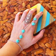 Lots of pretty boho jewels that would make the perfect Christmas gift for your bohemian friends! Here is our Zelda ring with Skye hand chain & ring. #bohemian #turquoise #bohojewelry #jewelry #statementring #rings #christmasgifts #giftideas #christmasgiftsideas #giftsforfriends #bohemianjewelry #statementjewelry #handchain #uniquejewelry #turquoisejewelry #slavebracelet #gypsy #festival Fall Wedding Shoes, How To Wear Headbands, Zelda Ring, Turquoise Bracelets, Bohemian Baby Shower, Boho Jewels, December Birthstone Jewelry, Bohemian Bracelet, Lace Wedding Invitations