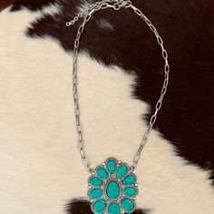 Boast your boho style with The Okley Necklace! Crafted with a turquoise blossom and shimmery chain, this beauty will have 'em doin' a double-take! So go ahead, flaunt it — you're sure to make a statement wherever you go! (And when the compliments come, graciously accept 'em, okley-dokley?) length: 11" extended chain: 3" Bohemian Turquoise Flower Pendant Necklace, Bohemian Jewelry With Flower Pendant And Adjustable Chain, Adjustable Turquoise Flower Pendant Jewelry, Double Take, Go Ahead, Boho Style, Boho Fashion, Blossom, Turquoise