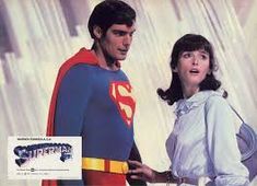 the man and woman are dressed in superman costumes