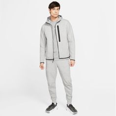 Men’s Nike 2 Separate Pieces Being Sold As A Set Jacket Full Zippered Hoodie - Smooth, Low Profile Fabric - Standard Fit - Front Pockets - 100% Sustainable Materials - Finished With Nike Grind Taping And Futura Logo Pants Slim Fit Tapered Leg Regular Length - Reflective Ticked Cotton Drawcord - Slashed Pockets 66% Cotton 34% Polyester Color May Differ Due To Lighting Winter Fleece Tracksuit In Athleisure Style, Sporty Fleece Tracksuit For Winter, Sporty Winter Fleece Tracksuit, Gray Fleece Joggers For Winter, Gray Fleece Winter Joggers, Winter Gray Fleece Joggers, Fleece Moisture-wicking Tracksuit For Streetwear, Moisture-wicking Fleece Tracksuit For Streetwear, Gray Athleisure Tracksuit With Drawstring Hood