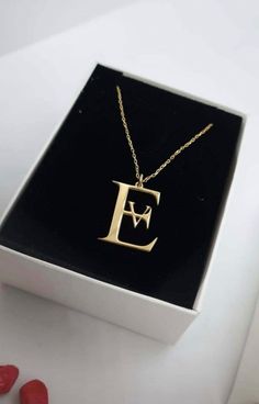 "celebrate your unique style? Look no further than this stunning 14K solid gold double letter name necklace! Crafted from premium-quality 14K gold, this minimalist initial necklace is the perfect way to show off your individuality and style. Whether you're looking to commemorate a special date, express your love for someone special, or simply add a touch of elegance to your everyday look, this customized couple jewelry is sure to impress. Featuring two delicate letters in a stylish cursive font, this personalized name necklace is a truly unique piece of jewelry. Whether you choose to wear it as a standalone piece or layer it with other necklaces for a more dramatic effect, it is guaranteed to make a statement. Perfect for gifting, this 14K solid gold double letter name necklace is an ideal Everyday Gold Jewelry, Letter Name Necklace, Everyday Jewelry Gold, Letter Necklace Initials, Gift For Anniversary, Fingerprint Jewelry, Cursive Font, Bracelets Gold Diamond, Couple Jewelry