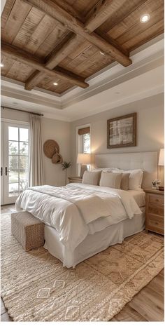 a large bed sitting under a wooden ceiling