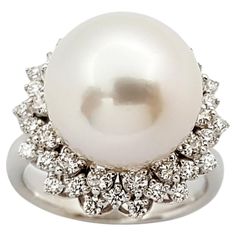 South Sea Pearl with Diamond 0.38 carat Ring set in 18 Karat White Gold Settings Width: 1.8 cm Length: 1.8 cm Ring Size: 51 Total Weight: 8.92 grams South Sea Pearl: 12.6 mm "We first opened doors in 1980 when it was then situated in the vicinity of the Victory Monument; a small and modest storefront with a couple of counters. From its humble beginnings to where it stands today, our company has proven its abilities as a jeweler. Since the beginning, we have been supplying fine quality pieces to Luxury Pear-shaped Diamond Ring With 17 Jewels, Luxury Brilliant Cut Pearl Ring For Formal Occasions, Luxury Pearl Ring With Brilliant Cut For Formal Occasions, Luxury Formal Cluster Diamond Ring, Luxury Diamond White Pearl Ring For Formal Occasions, Luxury White Platinum Cluster Ring, Timeless White Gold Pearl Ring With Diamonds, Luxury Pearl Ring With Diamond Pave Setting, Timeless Diamond Cluster Ring With 17 Jewels