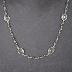 This beautiful necklace is sterling silver. It features an estimated 18 carats in green amethyst and 2.8 carats in chrome diopside. It is adjustable from 17.5 to 18.5 inches. Marks: 925 Condition: Excellent Elegant Silver Necklace With Green Amethyst, Green Fine Jewelry Necklace With Polished Finish, Fine Jewelry With Green Amethyst, Formal Peridot Gemstone Necklaces, Green Sterling Silver Crystal Gemstone Necklaces, Green Sterling Silver Crystal Necklace With Gemstone, Green Gemstone Accented Sterling Silver Necklace, Green Gemstone Sterling Silver Necklaces, Green Sterling Silver Crystal Necklaces With Gemstone