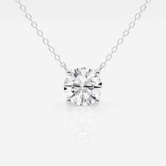 a diamond necklace on a white background