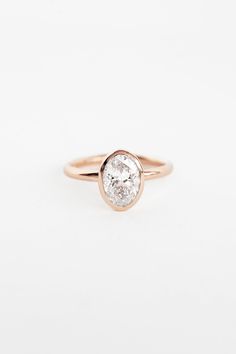 This minimalist beauty is fabulous and practical. An oval-cut lab diamond shines out from within a sleek bezel setting, framing the prismatic sparkling stone so that it is super stable. Rising about 1/4" above the finger, the overall effect is one of modern romance, but this ring will be an heirloom for generations. We responsibly source lab grown diamonds made only in the USA. These stones follow internationally recognized environmental standards and have the same strength of material and spark Aura Ring, Pride Necklace, Pearl Birthstone, Minimalist Beauty, Modern Romance, Gold Wedding Band, Diamond Color, Gift Accessories, Silver Diamonds