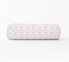 a pink and white baby crib mattress on a white background