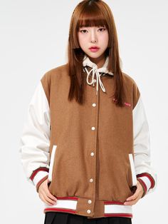 It is a casual and stylish varsity jacket with colorblock point. Made of wool blend fabric, it is comfy and cozy. The jacket has cute artwork patches and logo embroidery on the back. It has colorblock sleeves and stripe point on the ribbed parts.- Oversized fit- Ribbed neck, cuffs, hem- Snap button closure- Side pockets Trendy Winter Varsity Jacket With Contrast Color, Casual Brown Hooded Varsity Jacket, Varsity Style Long Sleeve Outerwear With Contrast Color, Casual Outerwear With Contrast Color For College, Casual College Outerwear With Contrast Color, Casual Contrast Color Outerwear For College, Fall College Style Outerwear For School, Trendy Contrast Color Outerwear For College, Winter Outerwear With Contrast Color In Campus Style