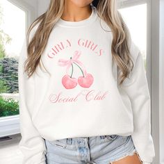 Hey there, Girly Girls Social Club member! Are you ready to cozy up in style with a touch of feminine flair? Introducing our "Girly Girls Social Club" Sweatshirt – the perfect blend of comfort and chic for every girly girl out there! Crafted from premium fleece fabric, this sweatshirt feels like a warm hug on a chilly day. The playful "Girly Girls" graphic adds a pop of personality to your wardrobe, celebrating your love for all things fabulous and fun. Whether you're cuddled up on the couch with a rom-com marathon or heading out for a shopping spree with your besties, our sweatshirt is your go-to choice for casual glam. Its relaxed fit ensures you stay comfortable and stylish, no matter where your day takes you. From brunch dates to movie nights, this sweatshirt is as versatile as it is t Trendy Crew Neck Sweater, Trendy Cozy Fit Sweatshirt For Spring, Trendy Crew Neck Sweatshirt For Loungewear, Trendy Cozy Fit Cotton Sweater, Cute Letter Print Sweater For Loungewear, Cute Sweater With Letter Print For Loungewear, Cute Relaxed Fit Sweater With Letter Print, Cute Sweater With Letter Print And Relaxed Fit, Cute Graphic Print Sweater With Relaxed Fit