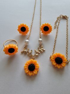 Sunflower earrings with matching necklace, bracelet and ring. Adjustable Alloy Jewelry For Gifts, Elegant Alloy Jewelry As A Gift For Her, Costume Jewelry With Jewels, Flower Shaped Alloy Jewelry For Gifts, Dainty Metal Jewelry In Flower Shape, Flower Shaped Alloy Jewelry Gift, Flower-shaped Alloy Jewelry For Gift, Dainty Metal Flower-shaped Jewelry, Flower-shaped Alloy Jewelry Gift