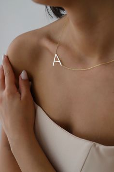 "Big letter necklaces are perfect for all outfits. It is so dainty, elegant and chic. Here you will find the super elegant initial necklace with us. You may design your alphabet necklace with any large letter you want. This sideways necklace will be a great silver gift idea for any women or mom. Big Letter form becoming really original and stylish. So you will have one of the most stylish gift in the world.  The gold name necklace is a durable solid necklace. First quality materials are used whi Elegant Everyday Letter Necklace, Everyday Letter Necklaces, Everyday Letter Shaped Necklaces, Simple Initial Pendant Necklace With Clavicle Chain, Minimalist Letter Necklaces For Everyday, Simple Initial Necklace With Clavicle Chain, Dainty Letter Necklaces For Everyday, Dainty Letter Necklaces For Everyday Wear, Dainty Letter Necklace For Everyday Wear