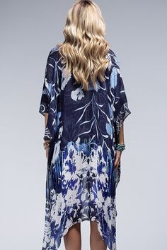 This kimono has a stunning all over floral print in a beautifull colorway! - 100% Viscose - 38"x40" - One size fits all Spring V-neck Kaftan With Digital Print, Spring Floral Print V-neck Kaftan, Elegant Blue Floral Print Kaftan, Spring Digital Print Kaftan, Multicolor Floral Print V-neck Kimono, Blue Rayon Kimono For Spring, Multicolor V-neck Kimono With Floral Print, Blue Long Floral Print Kaftan, Long Blue Floral Print Kaftan