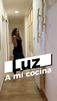 a woman taking a selfie in a hallway with the words luz on it